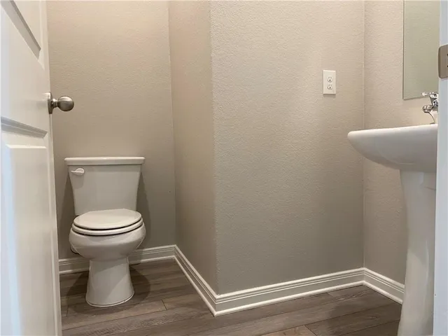 a bathroom with a toilet and a sink