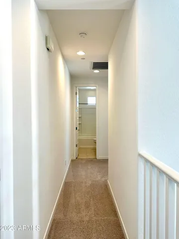 a view of a hallway with a white walls