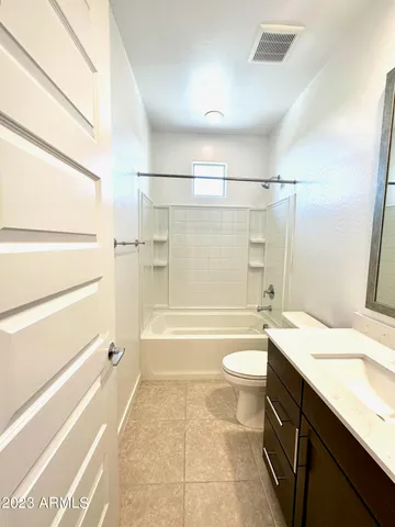 a bathroom with a sink a toilet and a bathtub