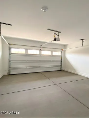 a bathroom with a bathtub and a window