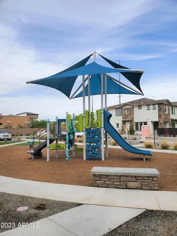 a view of a swimming pool with sitting area