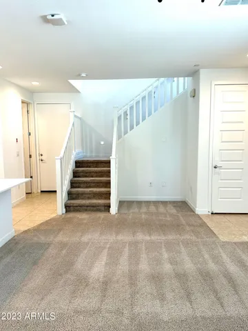 a view of an empty room with stairs