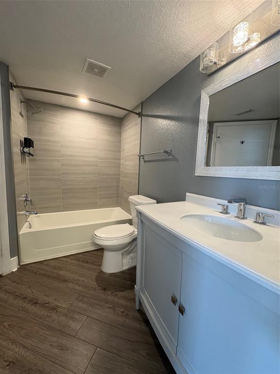 2203 Key W Court, Unit 422 Kissimmee, FL 34741 - Photo 11 of 41 a bathroom with a sink a toilet and shower