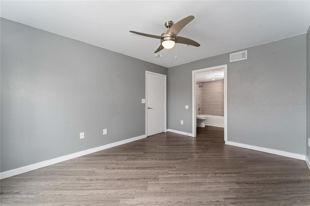 2203 Key W Court, Unit 422 Kissimmee, FL 34741 - Photo 15 of 41 a view of an empty room and wooden floor