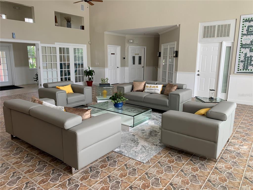 2203 Key W Court, Unit 422 Kissimmee, FL 34741 - Photo 23 of 41 a living room with furniture and a rug