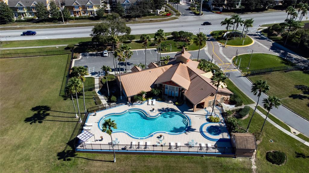 2203 Key W Court, Unit 422 Kissimmee, FL 34741 - Photo 25 of 41 an aerial view of a house with swimming pool and outdoor seating