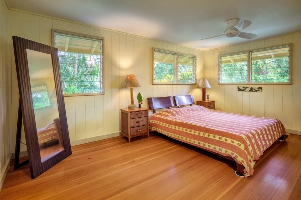5600 Weke Road Hanalei, HI 96714 - Photo 13 of 25 a bedroom with a bed and a window