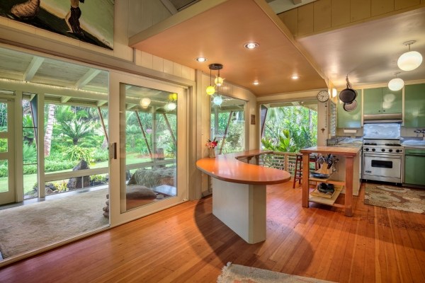 5600 Weke Road Hanalei, HI 96714 - Photo 4 of 25 a view of a dining room with furniture a chandelier and wooden floor