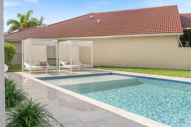 a view of swimming pool with outdoor seating