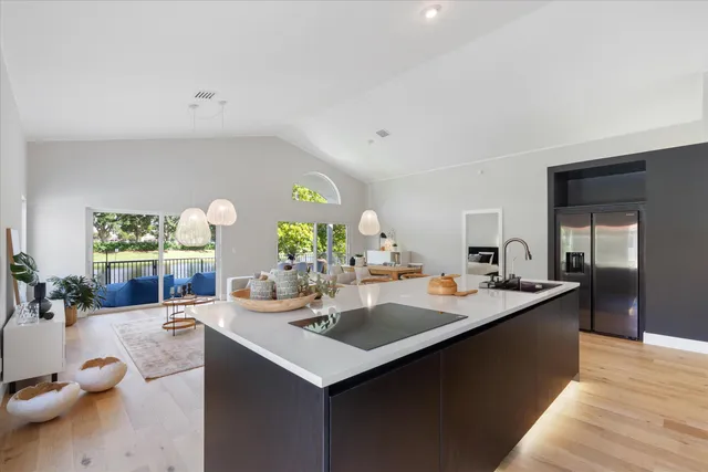 a kitchen with a sink and cabinets