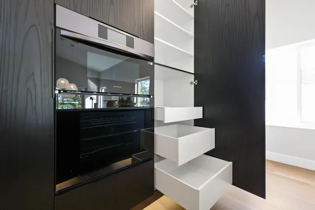 a view of entryway and kitchen