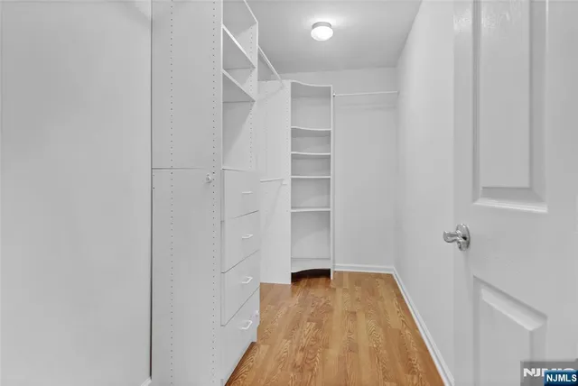 a view of a room with wooden floor and staircase