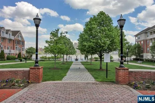 a view of a park with a large tree