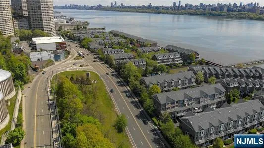 an aerial view of a house with a lake view
