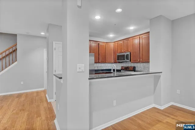 a view of kitchen with wooden floor