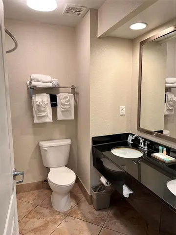 a sink with wooden cabinet
