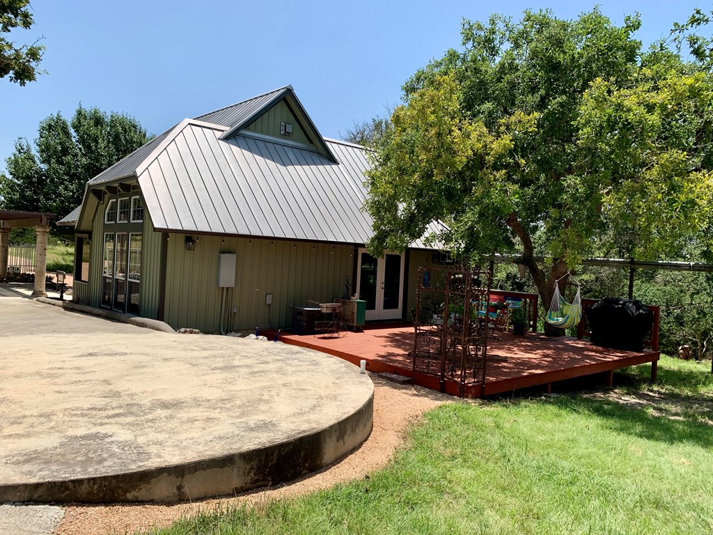 105 Fir Road Fredericksburg, TX 78624 - Photo 5 of 30 Back view of home and deck