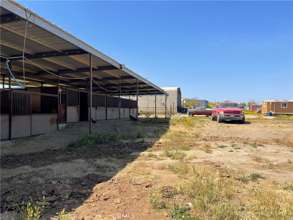 22285 Old Elsinore Road Perris, CA 92570 - Photo 13 of 16 a view of backyard with car parked