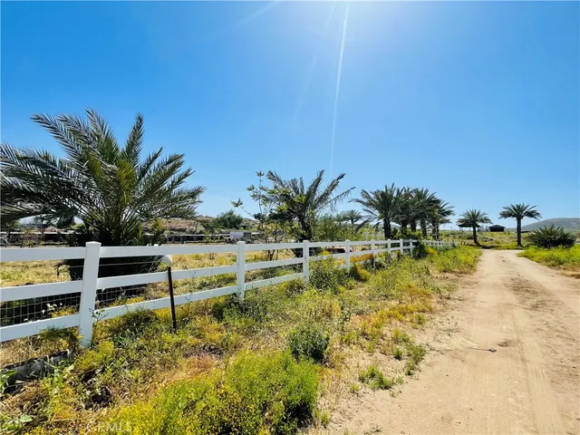 a view of a swimming pool and lounge chairs