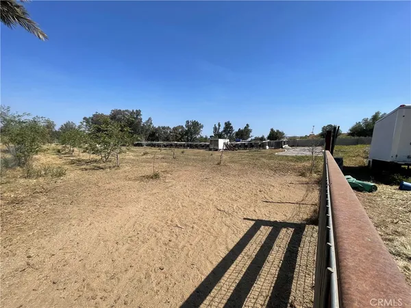 a view of a lake with houses in the background