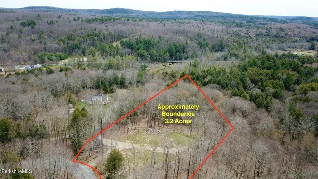 a aerial view of a house with a yard