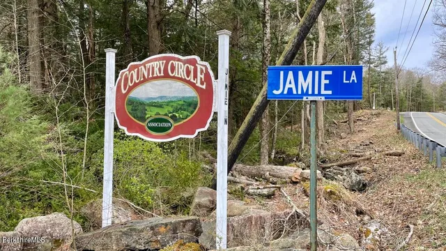 a sign that is on a brick wall