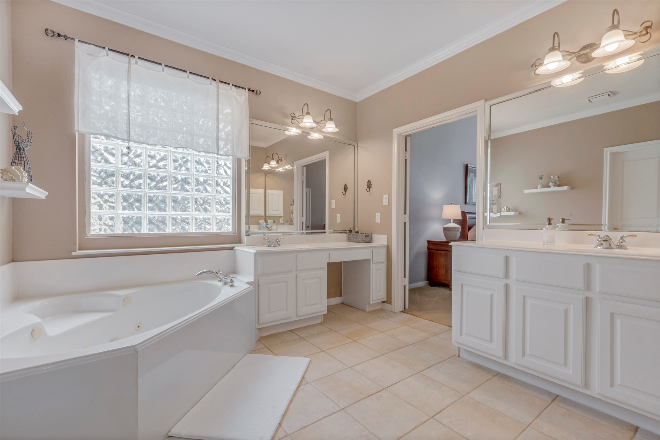 1120 Silveridge Conroe, TX 77304 - Photo 22 of 39 a bathroom with a double vanity sink a bathtub and shower