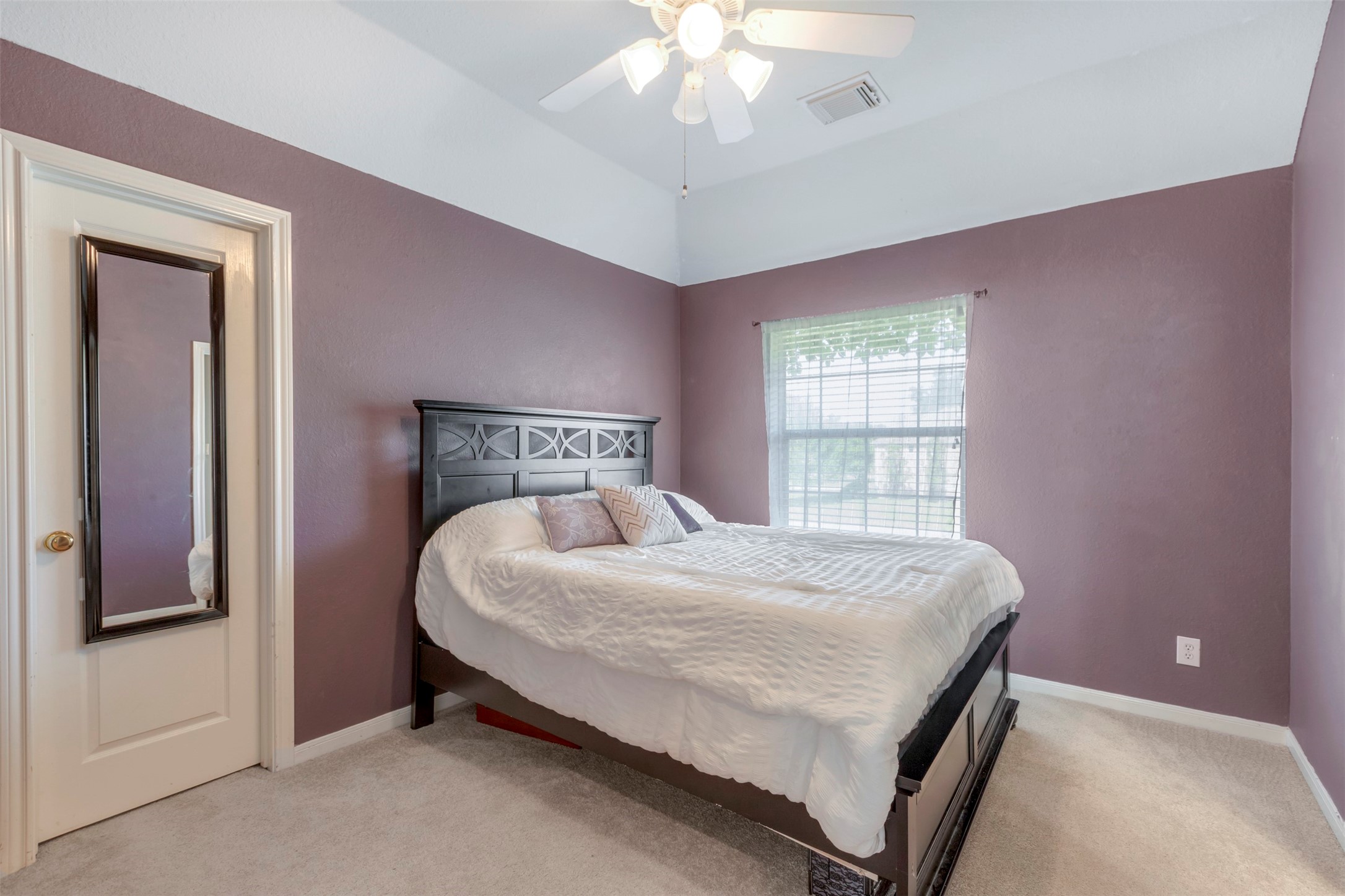 1120 Silveridge Conroe, TX 77304 - Photo 27 of 39 a bedroom with a bed and a window