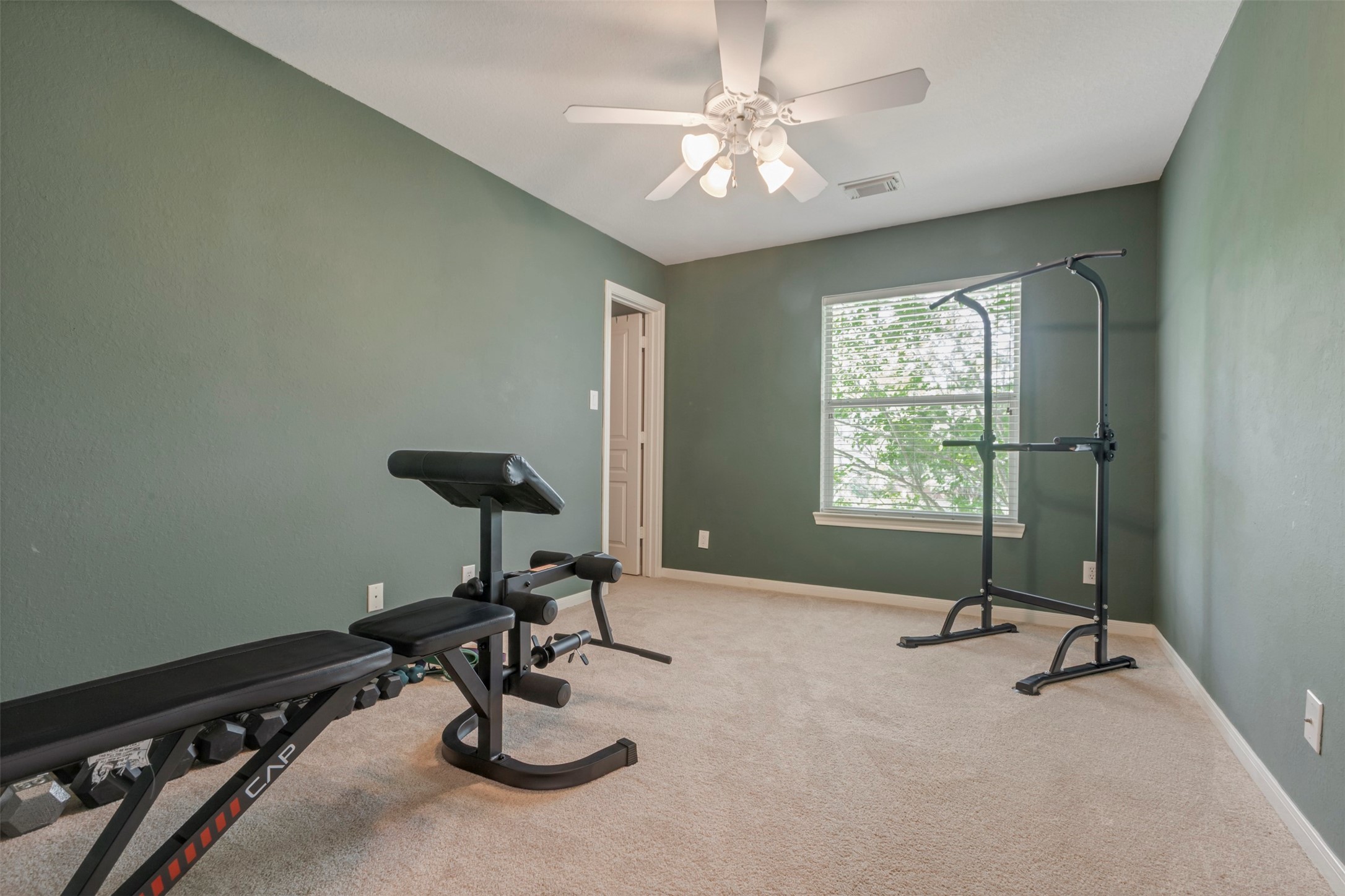 1120 Silveridge Conroe, TX 77304 - Photo 28 of 39 a view of a room with gym equipment