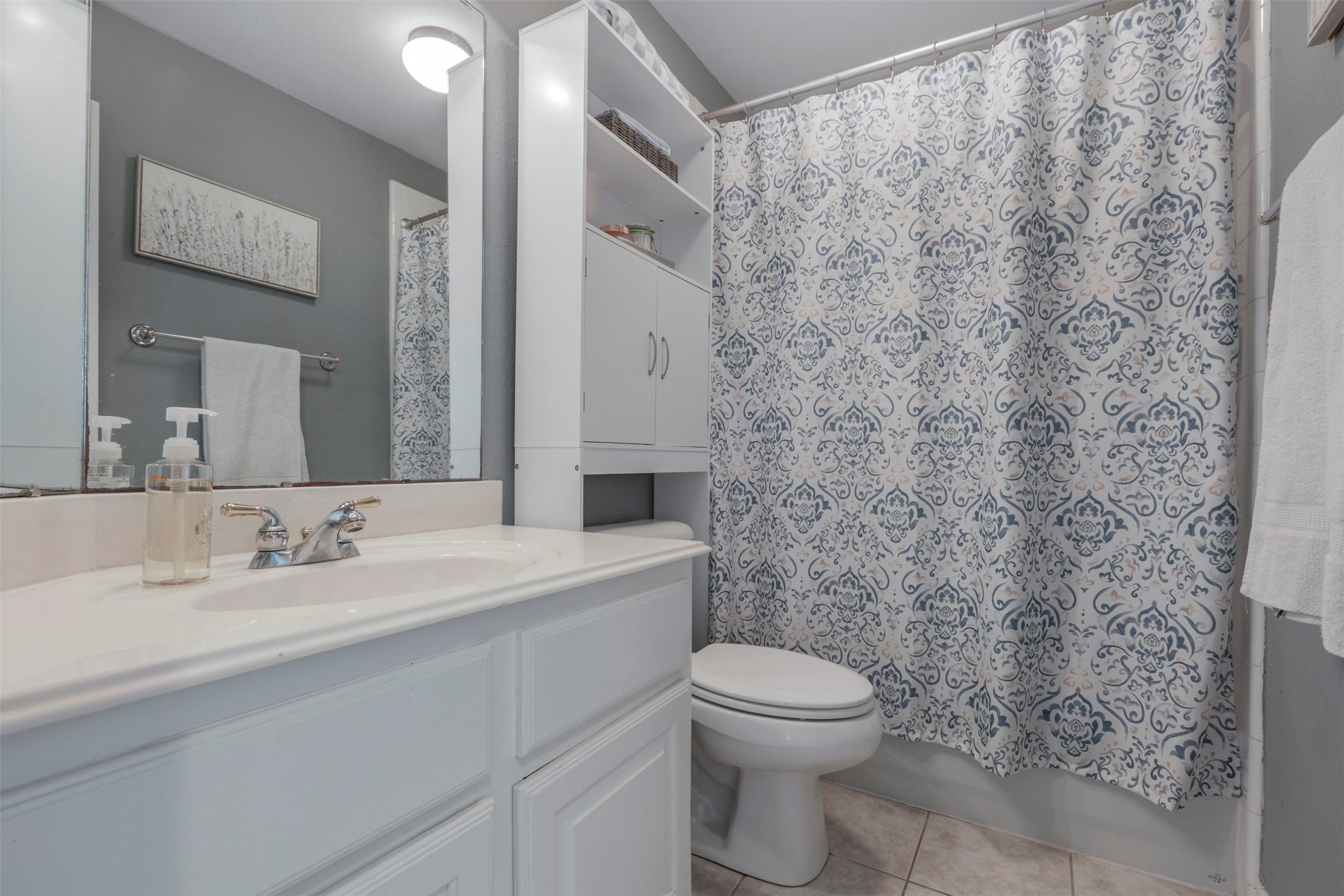 1120 Silveridge Conroe, TX 77304 - Photo 30 of 39 a bathroom with a toilet a sink and a mirror