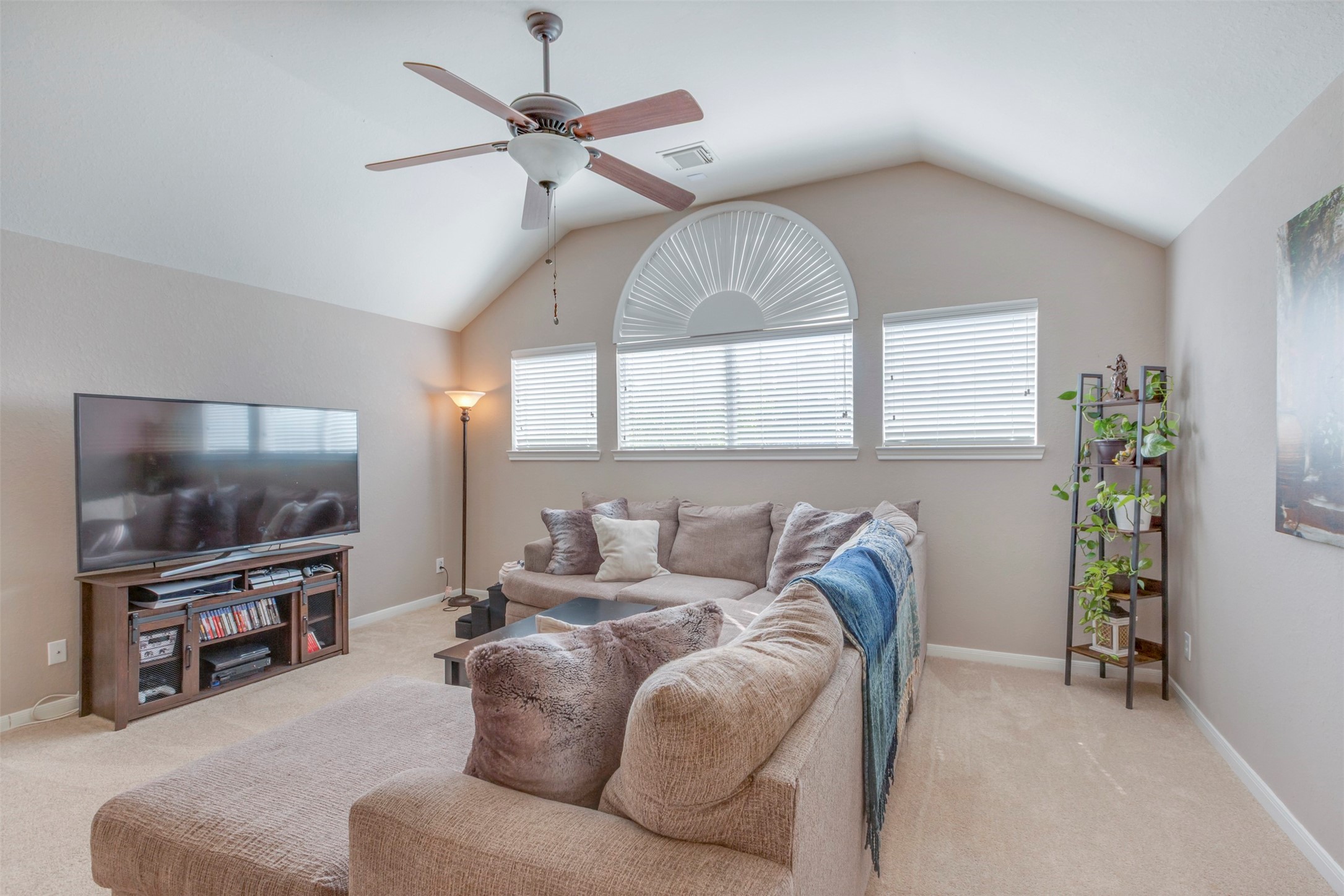 1120 Silveridge Conroe, TX 77304 - Photo 31 of 39 a living room with furniture and a flat screen tv