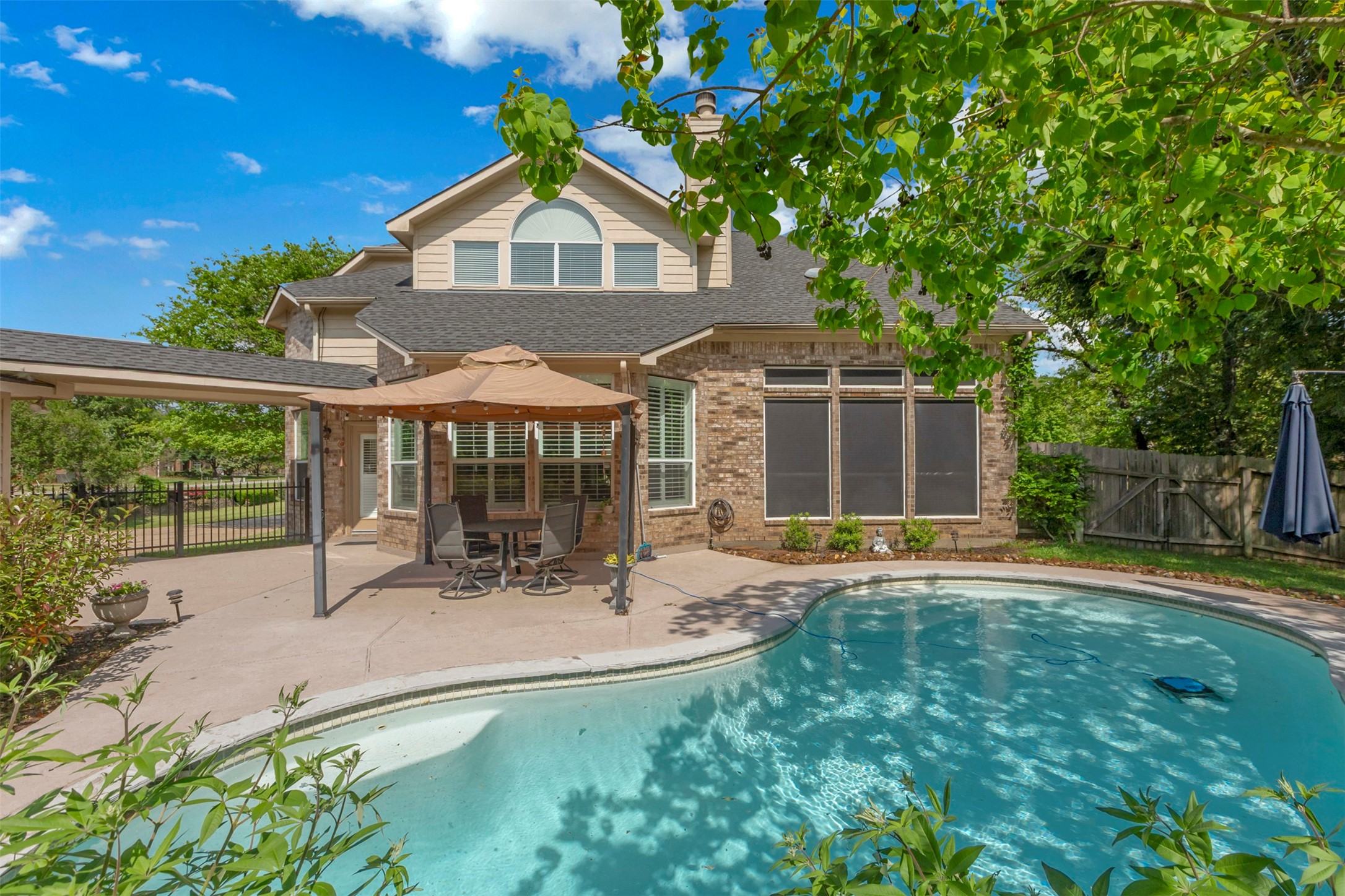 1120 Silveridge Conroe, TX 77304 - Photo 33 of 39 a front view of a house with a yard and porch
