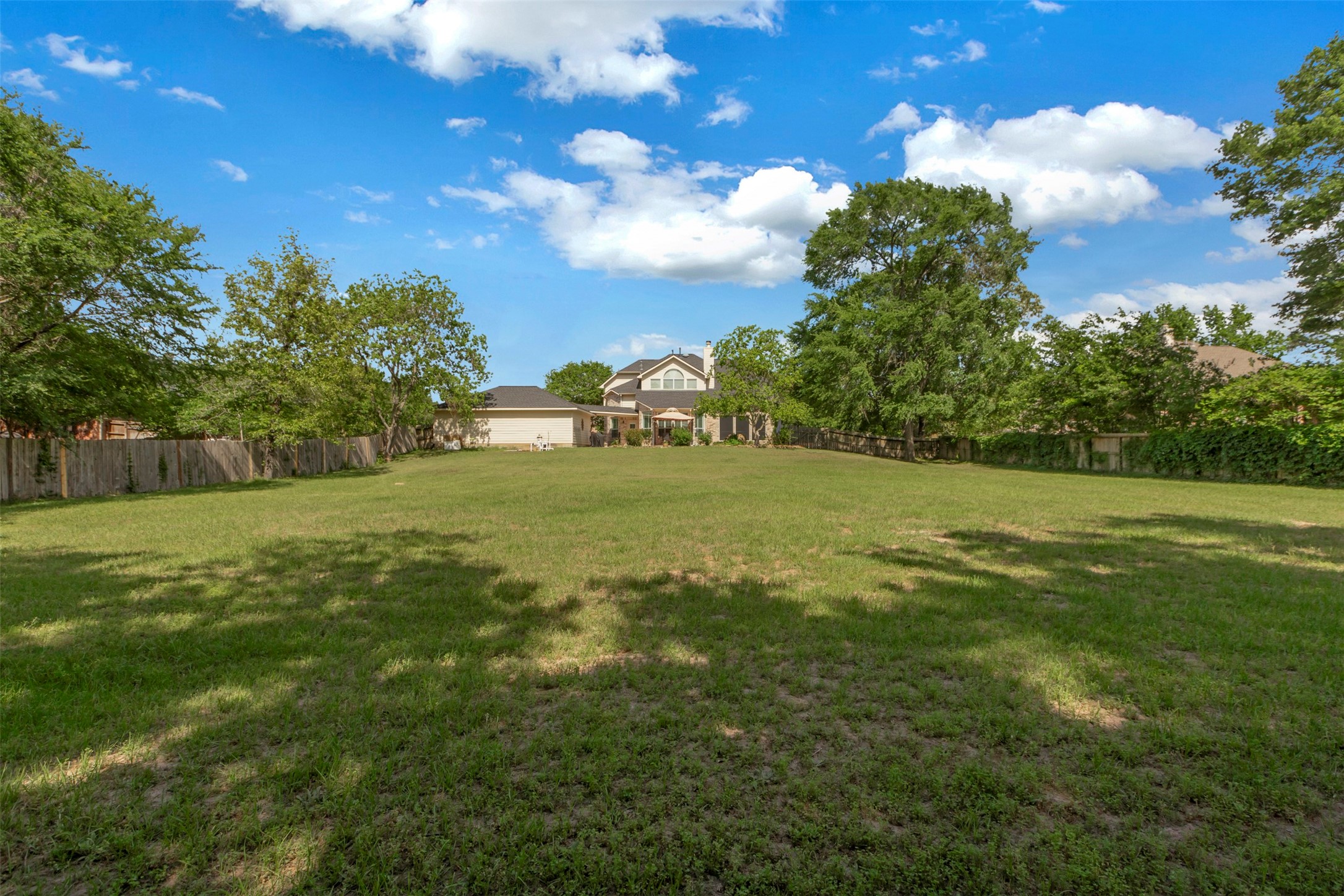 1120 Silveridge Conroe, TX 77304 - Photo 37 of 39 a view of a field with grass and a tree