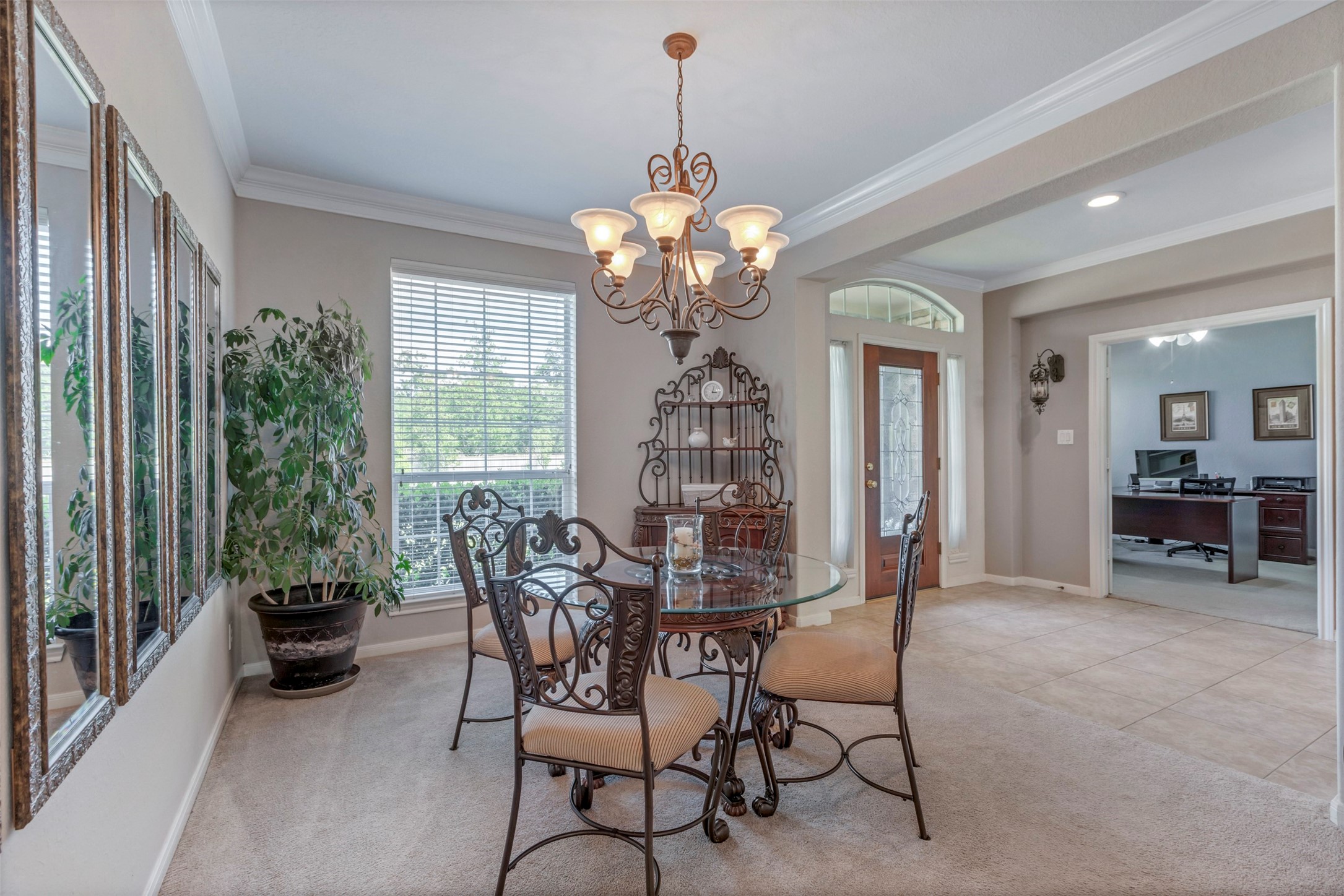 1120 Silveridge Conroe, TX 77304 - Photo 5 of 39 a view of a dining room with furniture and chandelier