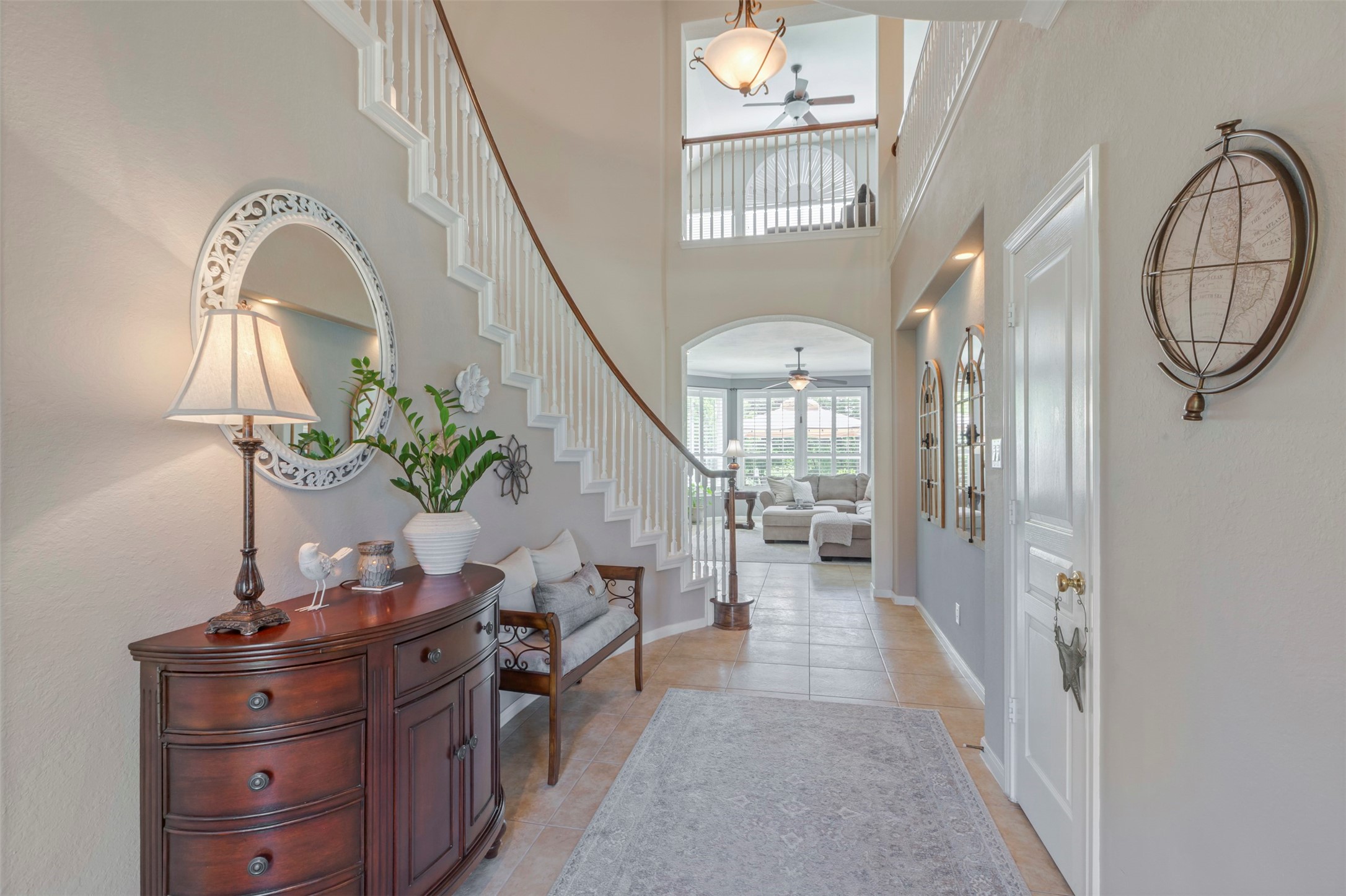 1120 Silveridge Conroe, TX 77304 - Photo 6 of 39 a living room with furniture a chandelier and a mirror