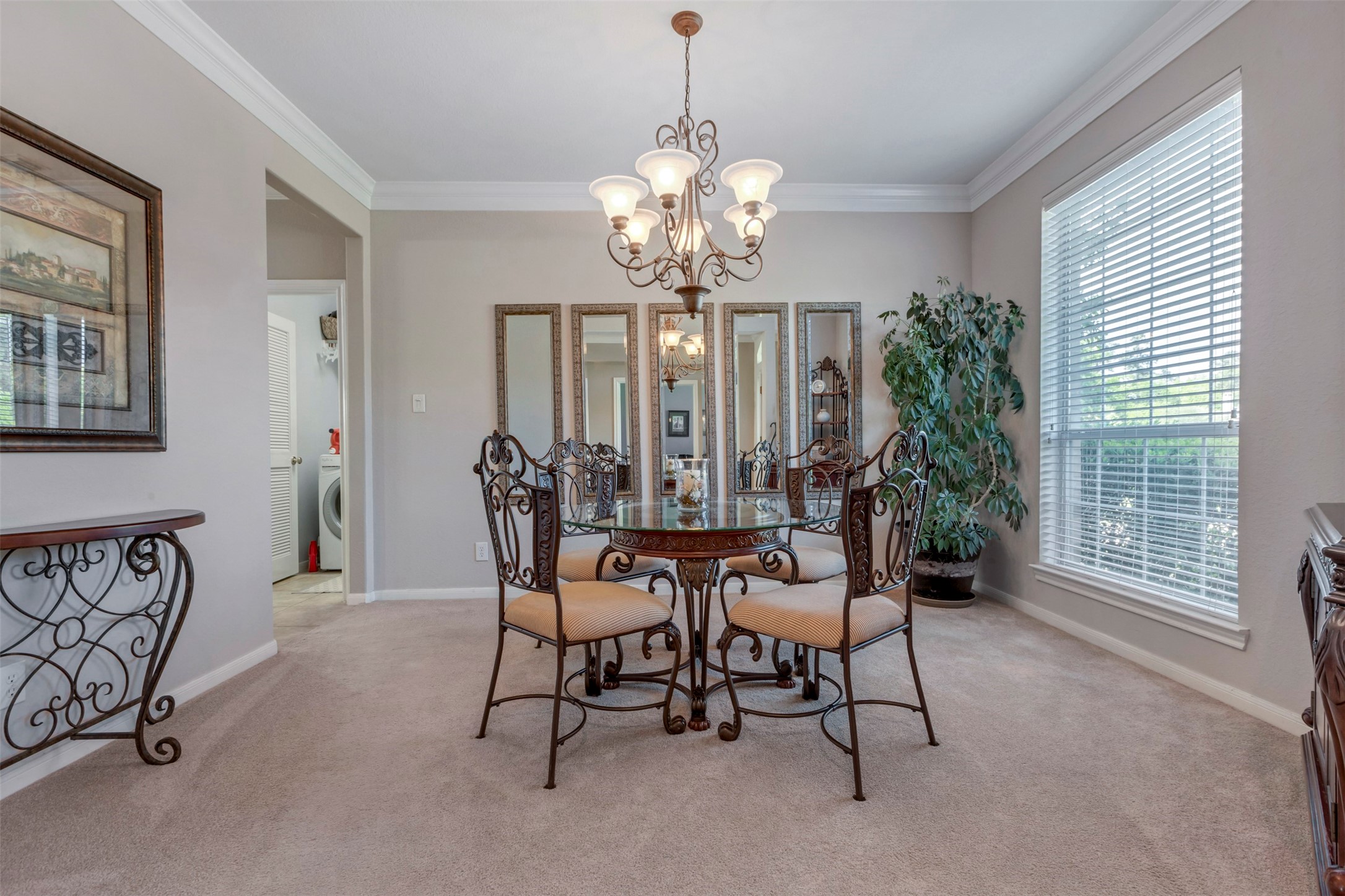 1120 Silveridge Conroe, TX 77304 - Photo 7 of 39 a view of a dining room with furniture and a chandelier