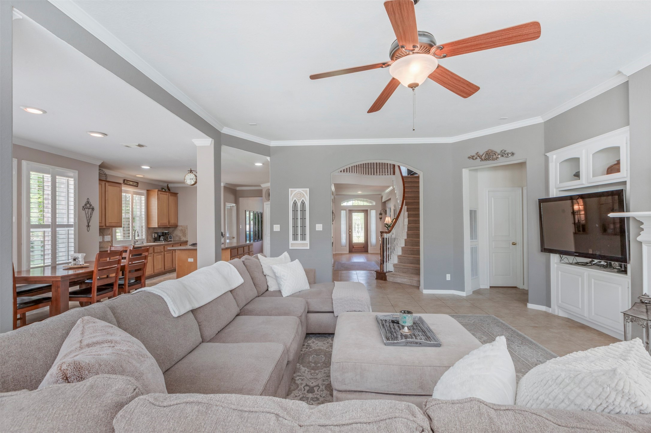 1120 Silveridge Conroe, TX 77304 - Photo 9 of 39 a living room with furniture and a flat screen tv