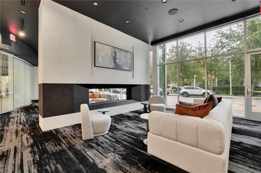 3324 Peachtree Road Northeast, Unit 2507 Atlanta, GA 30326 - Photo 21 of 25 a living room with furniture and a flat screen tv