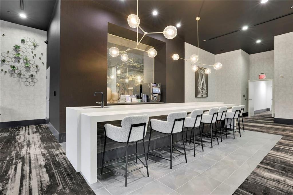 3324 Peachtree Road Northeast, Unit 2507 Atlanta, GA 30326 - Photo 22 of 25 an open kitchen with a table and chairs