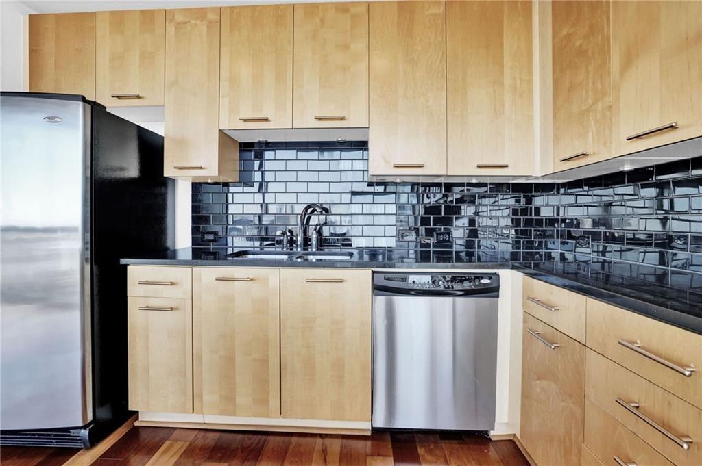 3324 Peachtree Road Northeast, Unit 2507 Atlanta, GA 30326 - Photo 8 of 25 a kitchen with stainless steel appliances a refrigerator sink and cabinets