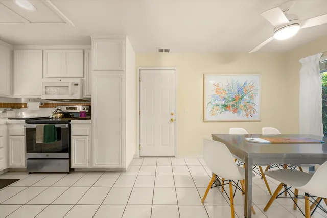 a kitchen with stainless steel appliances a stove a sink and a refrigerator