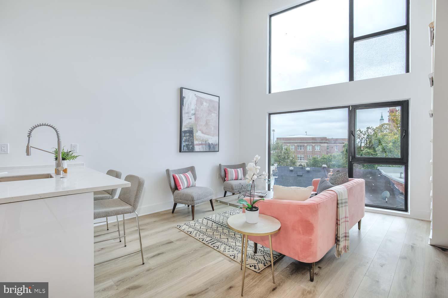 4328 Georgia Avenue Northwest, Unit 401 Washington, DC 20011 - Photo 2 of 32 a living room with furniture and a window