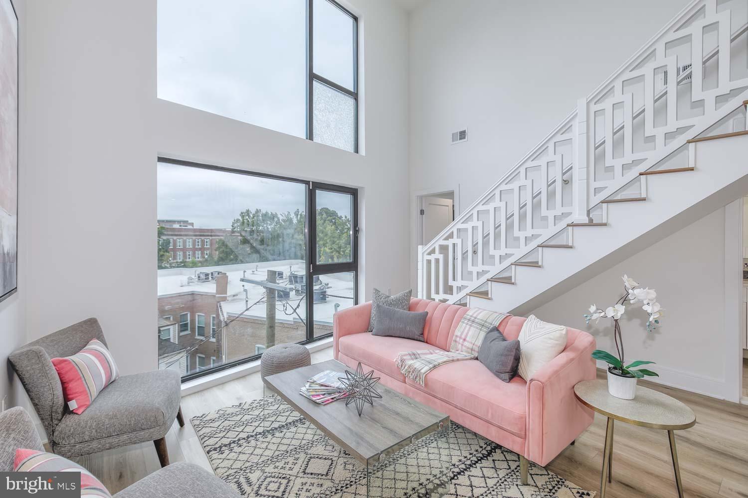 4328 Georgia Avenue Northwest, Unit 401 Washington, DC 20011 - Photo 22 of 32 a living room with furniture and a large window
