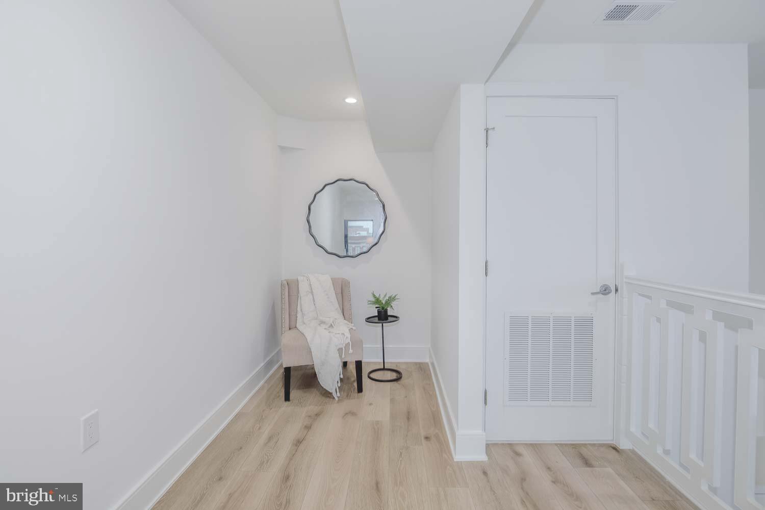 4328 Georgia Avenue Northwest, Unit 401 Washington, DC 20011 - Photo 26 of 32 a view of a room with wooden floor table and chairs