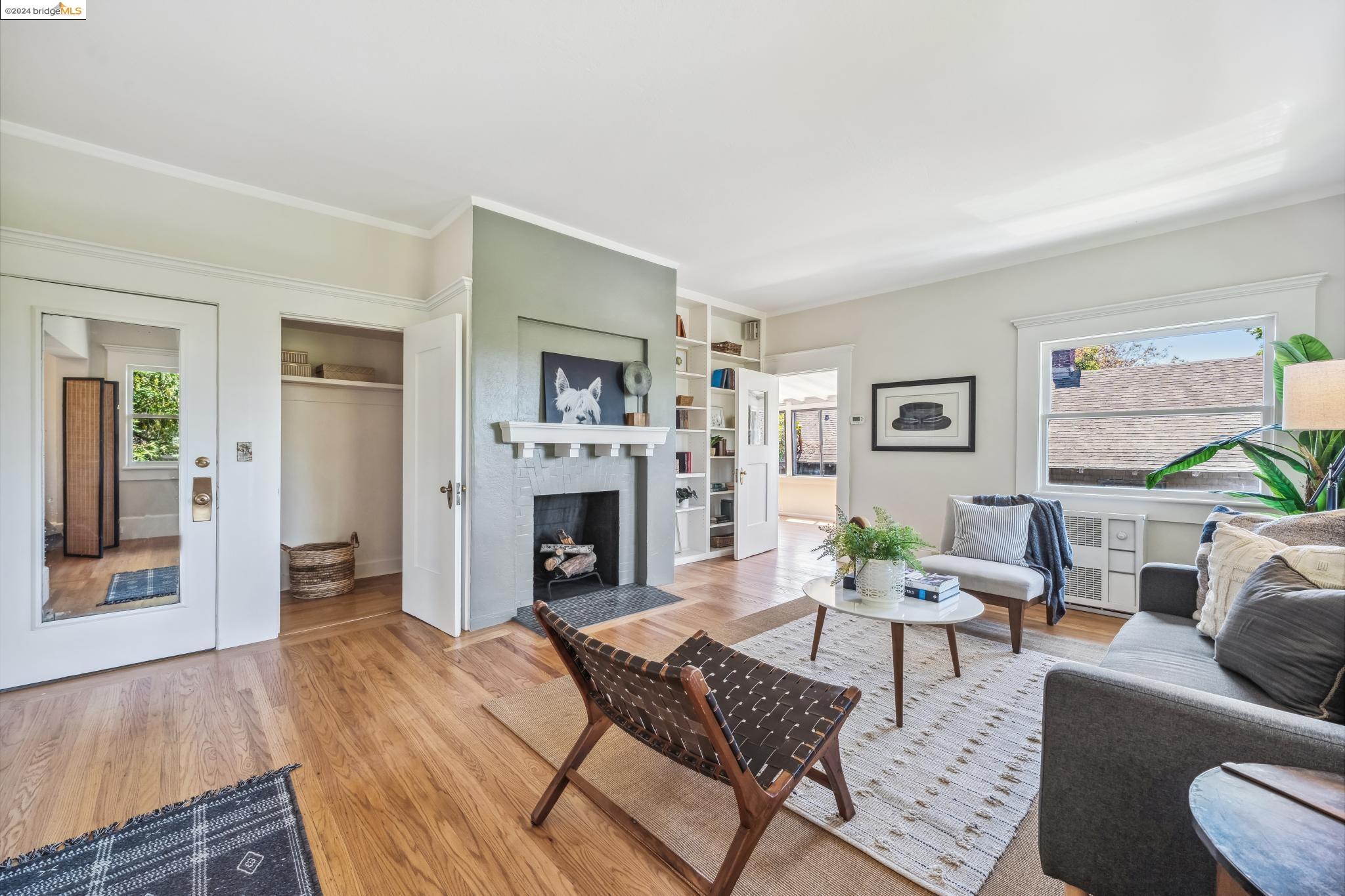 2519 Etna Street, Unit 2 Berkeley, CA 94704 - Photo 1 of 1 a living room with furniture and a fireplace