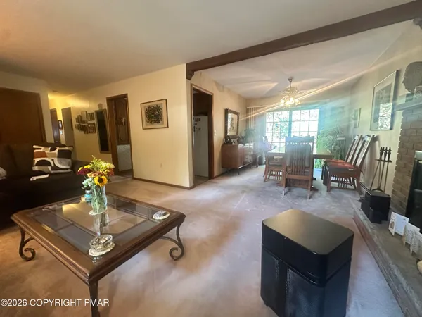 a living room with furniture and a table