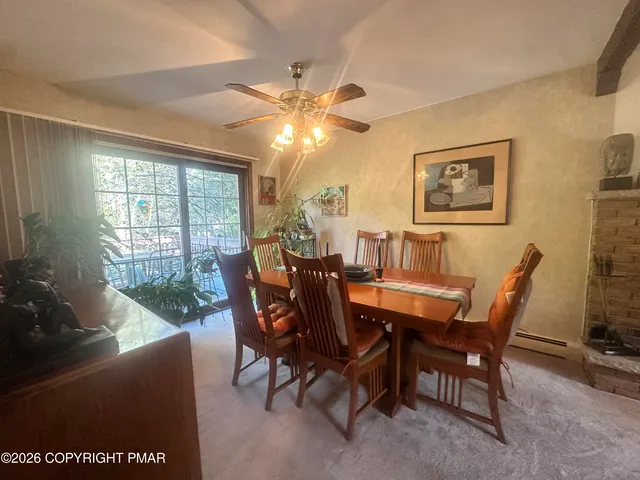 a dining room with furniture and window