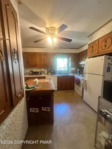 a kitchen with refrigerator and window
