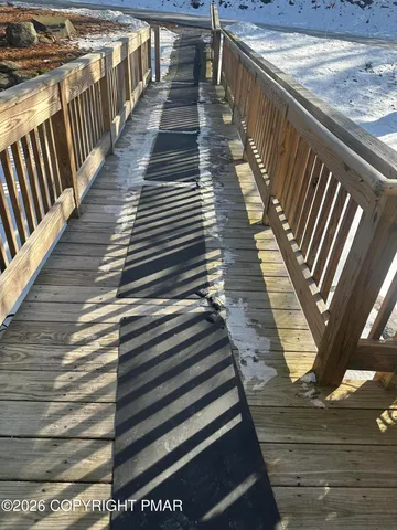 a view of a balcony with wooden floor