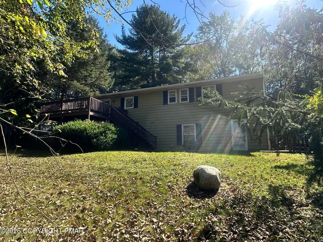 a backyard of a house with lots of green space